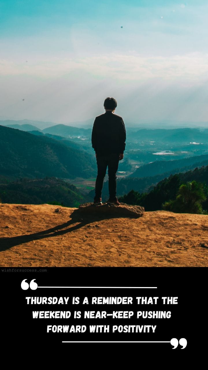 Best Positive Thinking Thursday Motivational Quotes Images Free Download | Motivational Wallpaper A person stands on a rocky hilltop, overlooking vast, lush mountains under a blue sky.