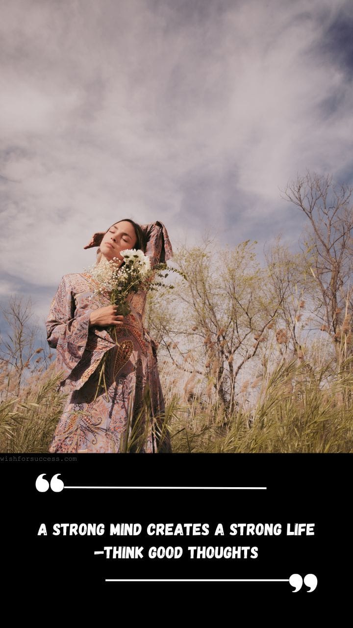 Best Positive Thinking Thursday Motivational Quotes Images Free Download | Motivational Wallpaper Woman in a patterned dress stands in a grassy field with eyes closed, holding wildflowers. Sky is partly cloudy.
